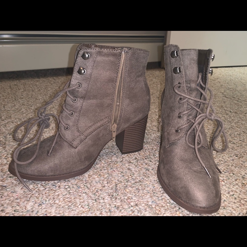 Comfortable heeled boots, with strap up detail.